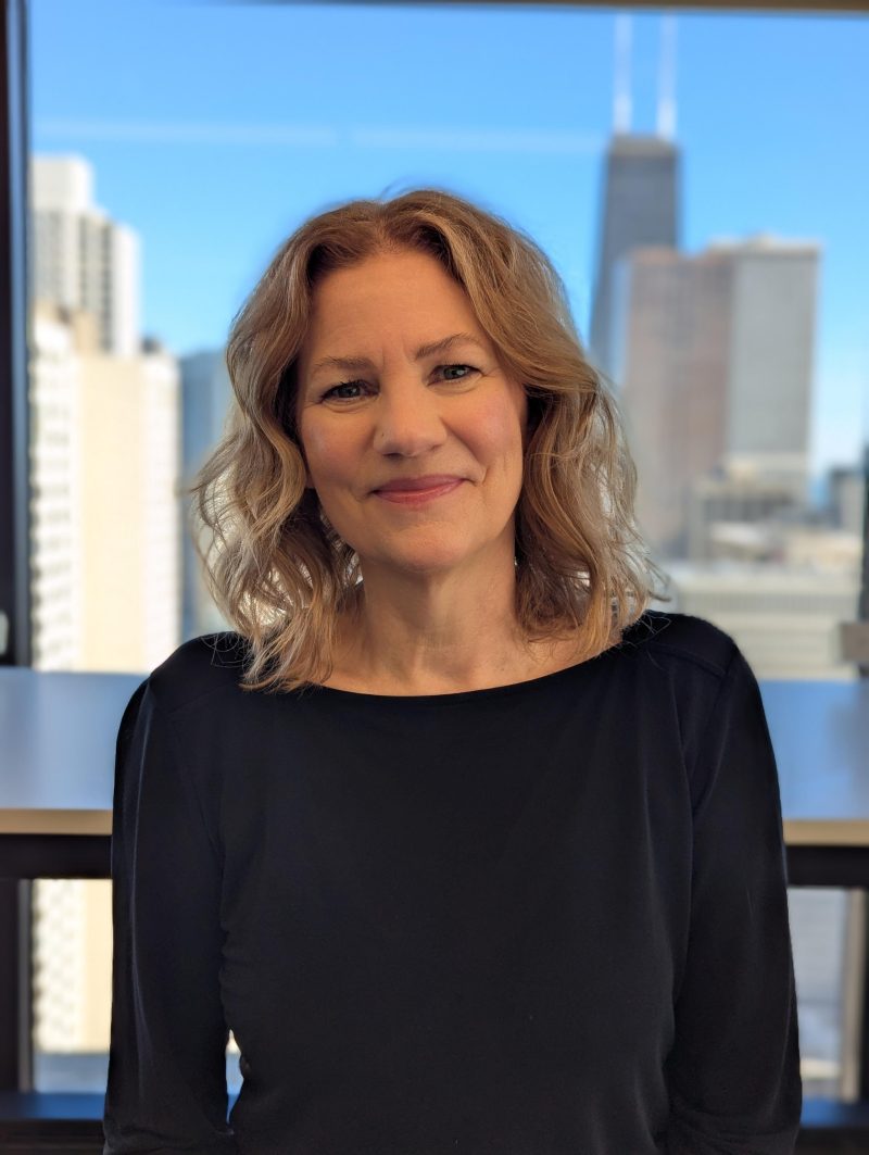 Susan Houriet with the Chicago skyline behind her